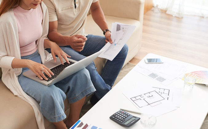 couple reviewing home remodeling plans